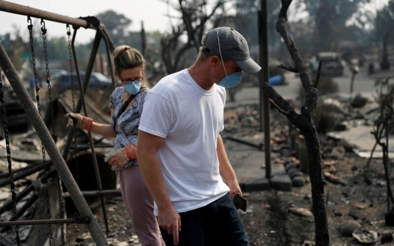 Harper Bishop and wife Cristy survey their home destroyed by the Tubbs Fire in Santa Rosa, California