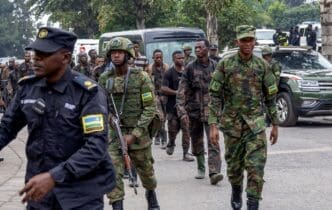Rwandan security officers receive FARDC soldiers who surrendered in Goma