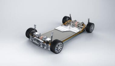 3D rendering of an electric vehicle battery featuring a module of battery cells displayed on a platform