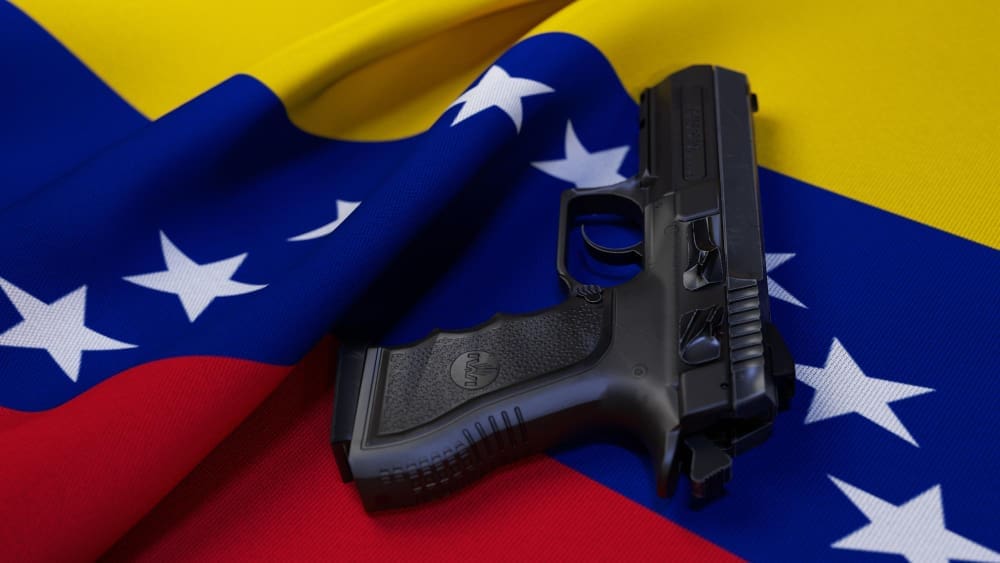 A black pistol on the flag of Venezuela