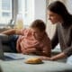 A medium shot of a boy and his mother sharing special moments together on a laptop while lying in bed