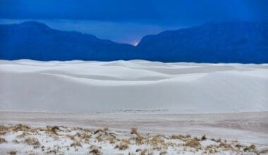 A picturesque view of White Sands National Monument set against the sky at sunset