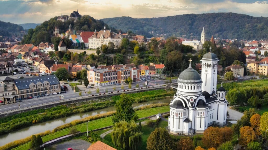 Aerial Drone Perspective of the Historic Center of Sighisoara, Romania Old Architecture and the Holy Trinity Church