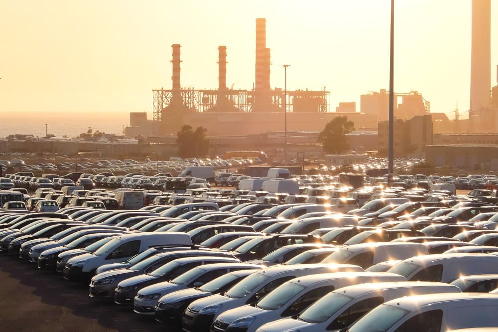 Brand new cars parked in an industrial area