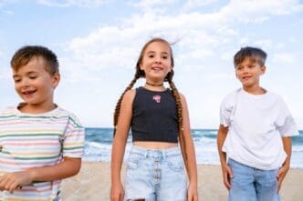 Children enjoying themselves at the beach from a front view