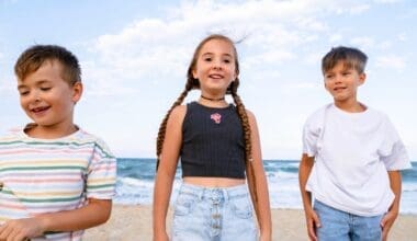 Children enjoying themselves at the beach from a front view