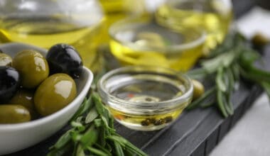 Composition with healthy olives and oil on kitchen table