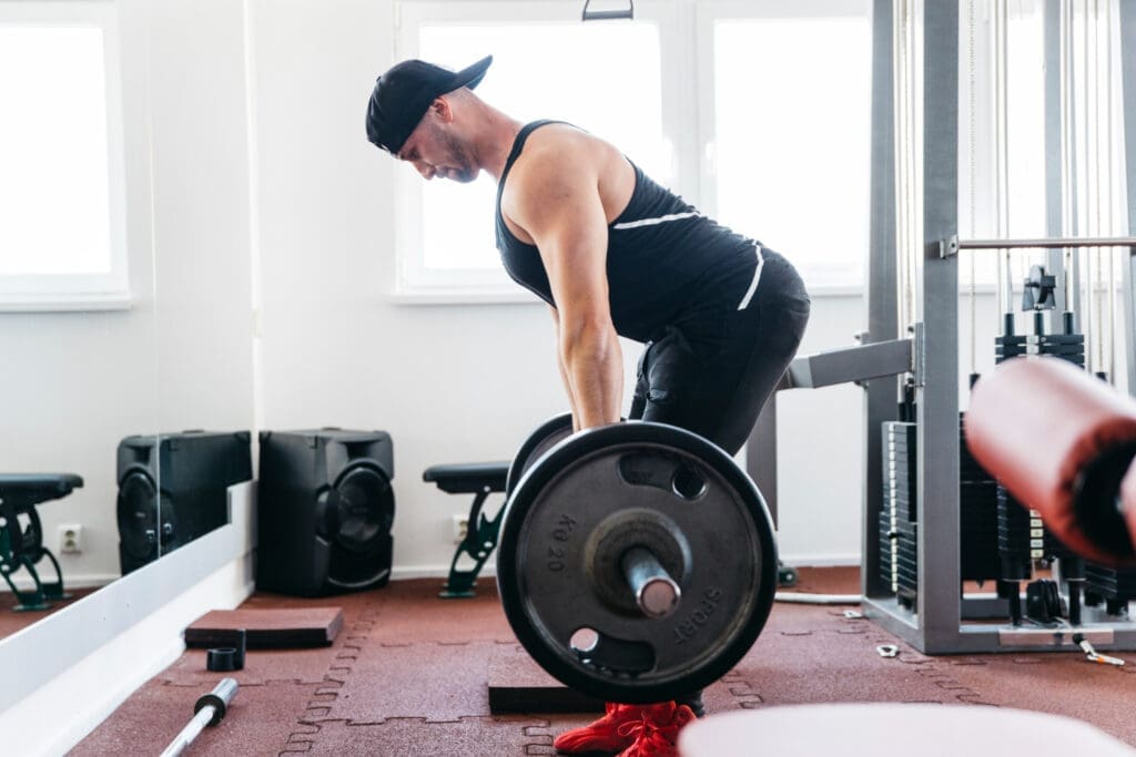 Man performing a Romanian deadlift in the gym