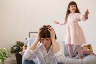Medium shot of a woman experiencing a headache