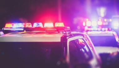 Police cruiser lights at a nighttime checkpoint