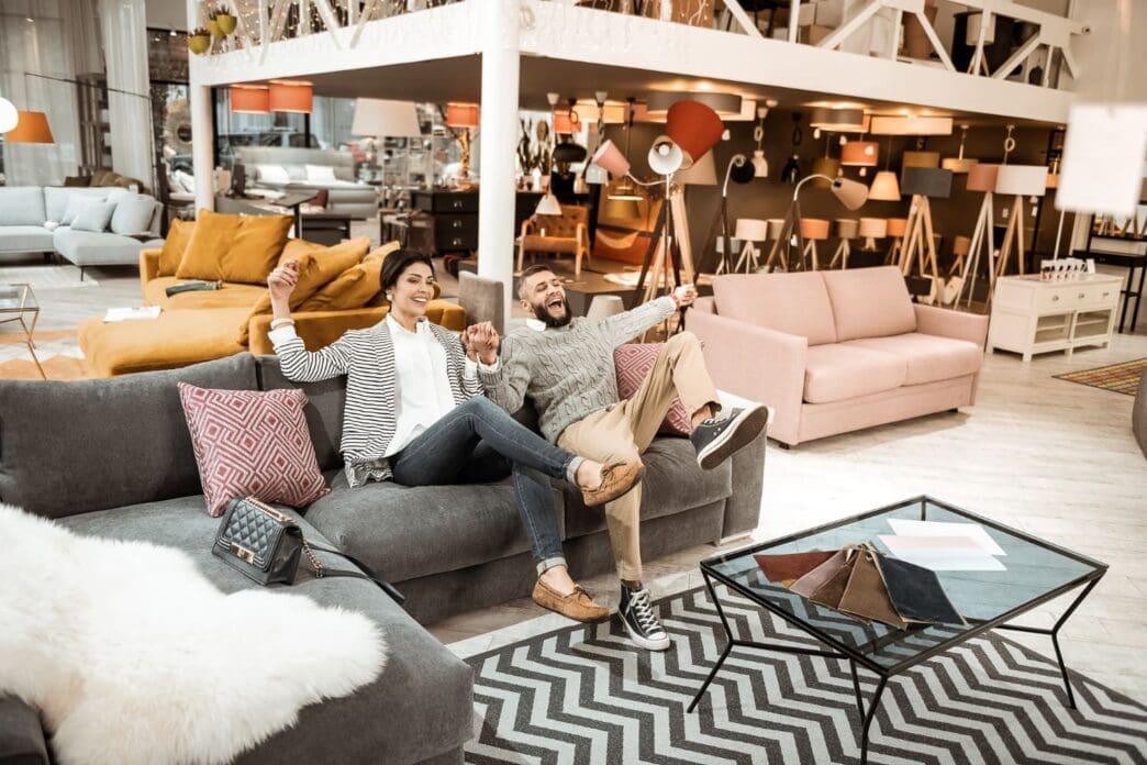 The U.S. imports a variety of goods from China, including bedding, mattresses, and furniture. Meanwhile, a delightful adult couple is happily exploring and enjoying their time in a furniture store