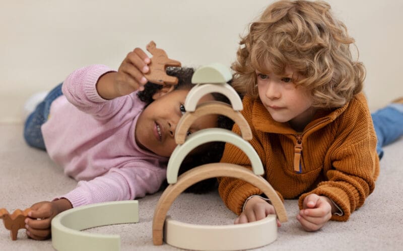 Wide-angle shot of children playing with eco-friendly toys