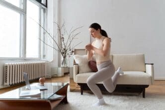 Woman exercising following guidance from an online fitness instructor