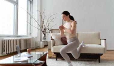 Woman exercising following guidance from an online fitness instructor