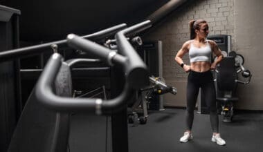 Woman showcasing her toned abs while engaging in fitness activities