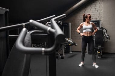 Woman showcasing her toned abs while engaging in fitness activities