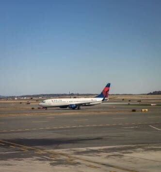 A Delta Airlines plane taxis at Boston Logan International Airport