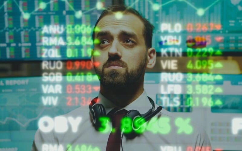 A business expert analyzes stock market charts and statistical graphs using AR visualization technology in a close-up view