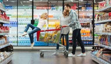 A cheerful young family with a child enjoying their shopping experience at Walmart