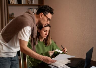 A couple feeling stressed about their financial challenges and tax obligations