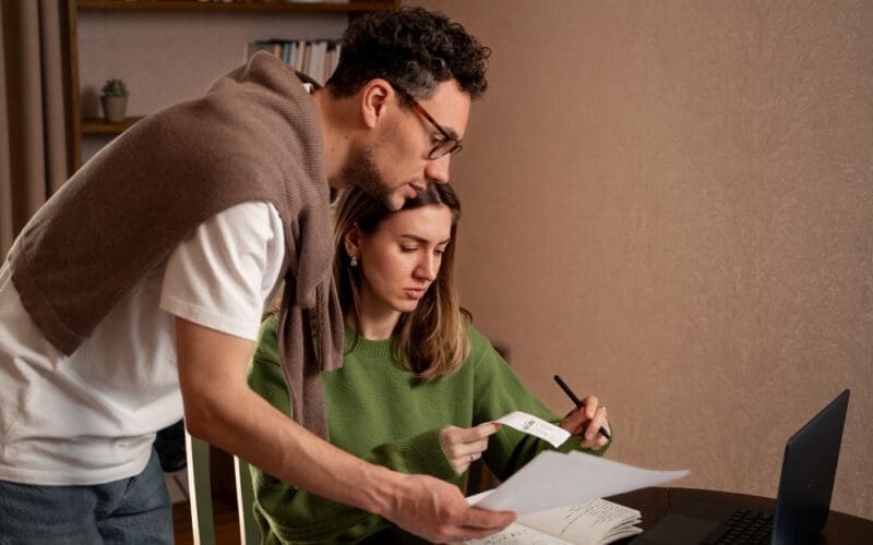 A couple feeling stressed about their financial challenges and tax obligations