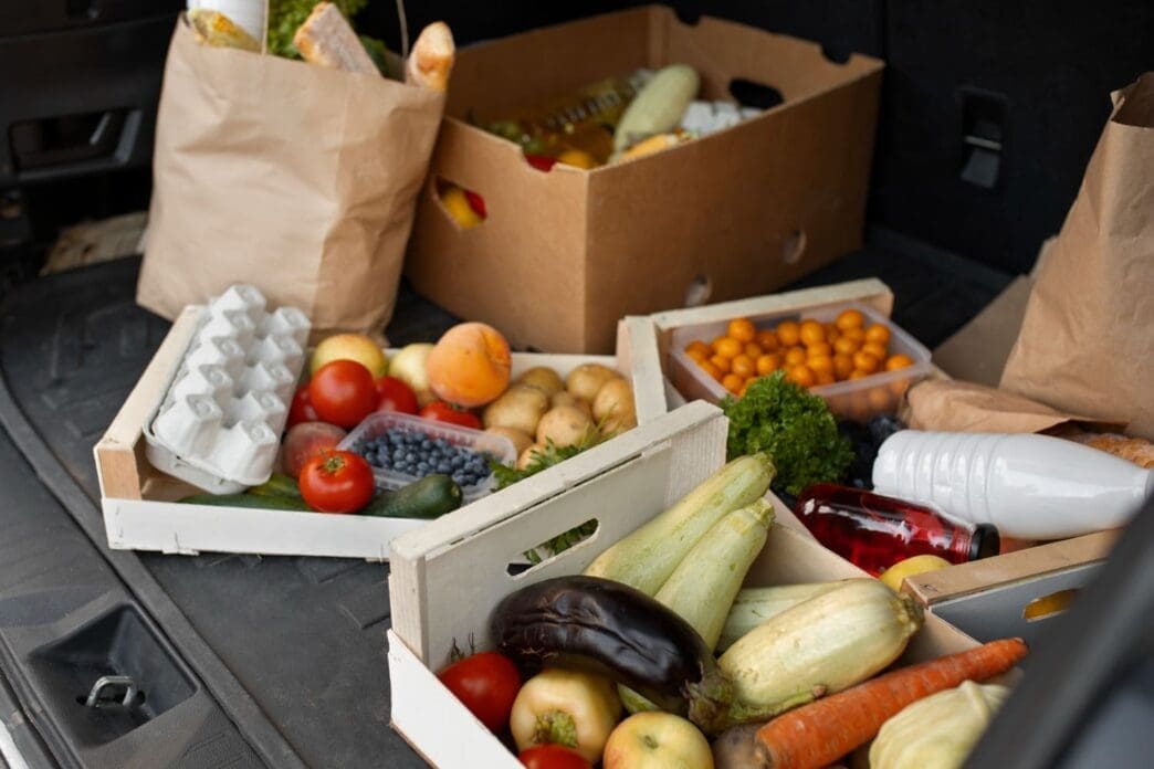 A family with groceries in an SUV heading home