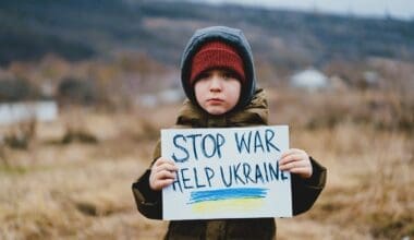 A sad boy pleads for an end to the war between Russia and Ukraine