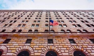 A street-level perspective of the Federal Reserve Bank of New York building, located in the Financial District of Lower Manhattan, New York City