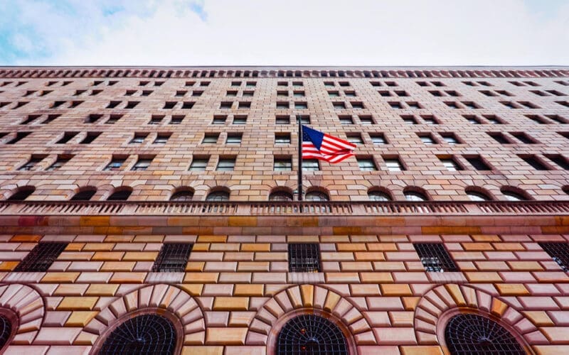 A street-level perspective of the Federal Reserve Bank of New York building, located in the Financial District of Lower Manhattan, New York City