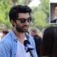 Actor Justin Baldoni talks to a reporter at the “Rocket’s Universe” grand opening, which is the 64th universally accessible playground built by Shane’s Inspiration