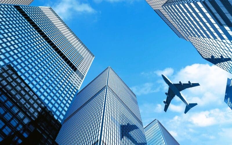 Airplane flying over building at Central Business District