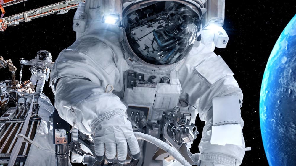 Astronaut spaceman do spacewalk while working for spaceflight mission