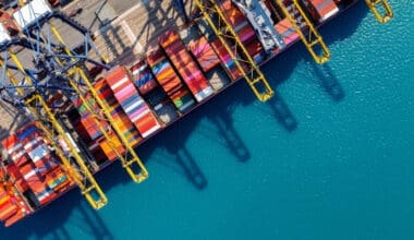 Bird's-eye view of a cargo ship and containers in the harbor