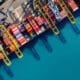 Bird's-eye view of a cargo ship and containers in the harbor