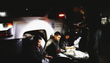 Border Patrol agents take three migrant men, a Mexican, a Guatemalan and a Honduran, who illegally crossed the Rio Grande River to enter the U.S. into custody