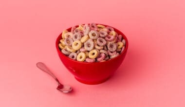 Bowl of cereal isolated on a pink background