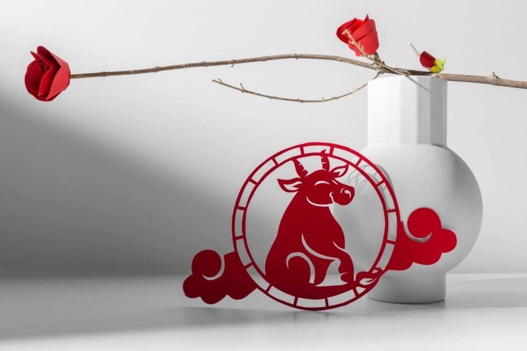 Chinese ornament featuring an ox and floral designs