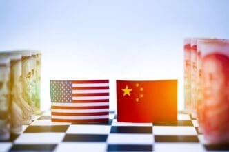 Close-up of a chessboard symbolizing the economic rivalry between the USA and China, featuring flags and currency from both nations