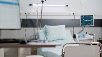 Empty emergency room with heart rate monitor