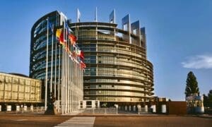 European Parliament building in Strasbourg, France, set against a clear blue sky