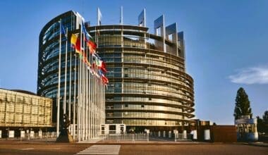 European Parliament building in Strasbourg, France, set against a clear blue sky