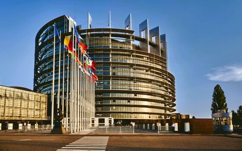 European Parliament building in Strasbourg, France, set against a clear blue sky