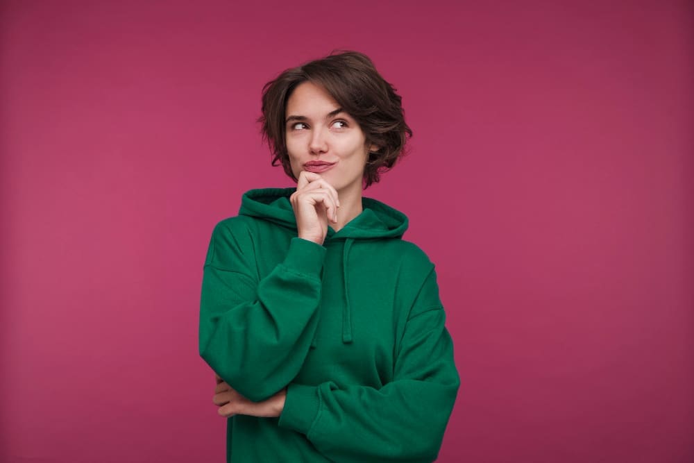 Front view of a young woman gazing thoughtfully