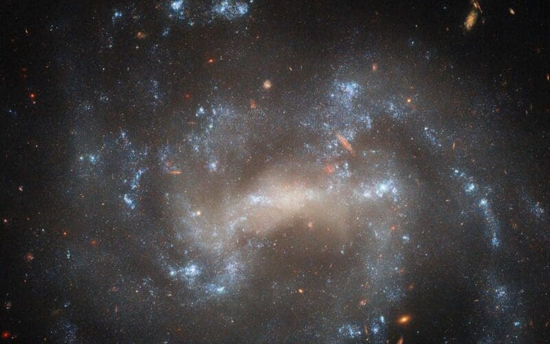 The spiral galaxy UGC 5460 shines in this NASA/ESA Hubble Space Telescope image. UGC 5460 sits about 60 million light-years away in the constellation Ursa Major.