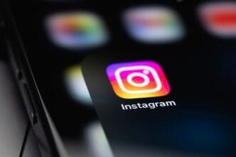Instagram icon mobile app on a screen smartphone iPhone closeup Instagram is a photo-sharing app for smartphones