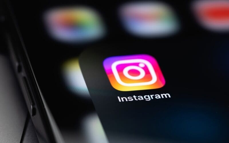 Instagram icon mobile app on a screen smartphone iPhone closeup Instagram is a photo-sharing app for smartphones