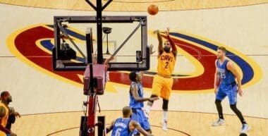 Irving shoots a jump shot vs the Dallas Mavericks in 2014. Photo by flickr.com, CC BY 2.0, via Wikimedia Commons
