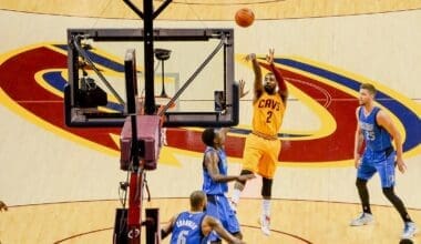 Irving shoots a jump shot vs the Dallas Mavericks in 2014. Photo by flickr.com, CC BY 2.0, via Wikimedia Commons