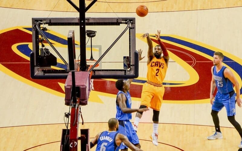 Irving shoots a jump shot vs the Dallas Mavericks in 2014. Photo by flickr.com, CC BY 2.0, via Wikimedia Commons