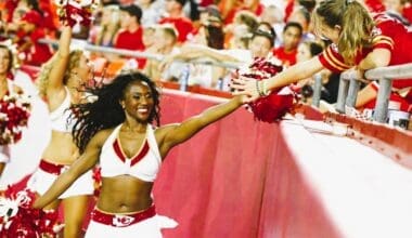 Krystal Anderson high fives fan during a Chiefs game